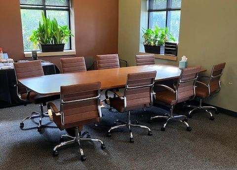 brown conference table and chairs