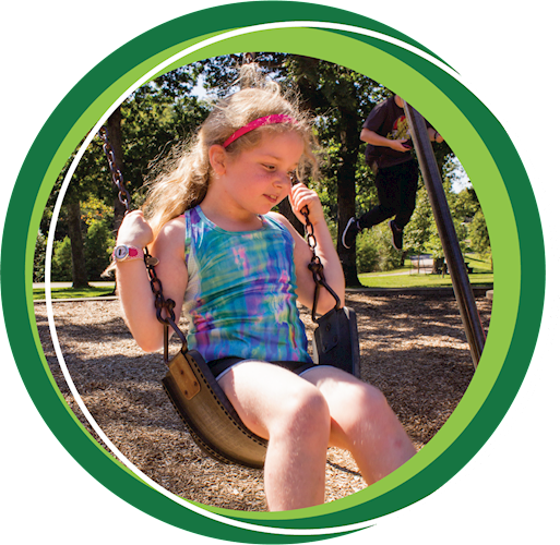 Girl swinging in a park.