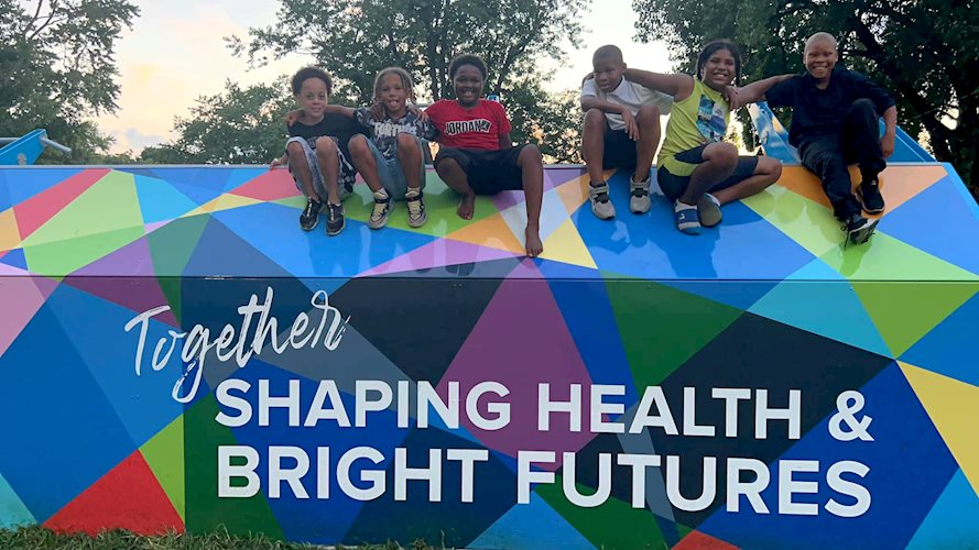 kids climbing on new outdoor fitness park equipment at comer cox park in july of 2022