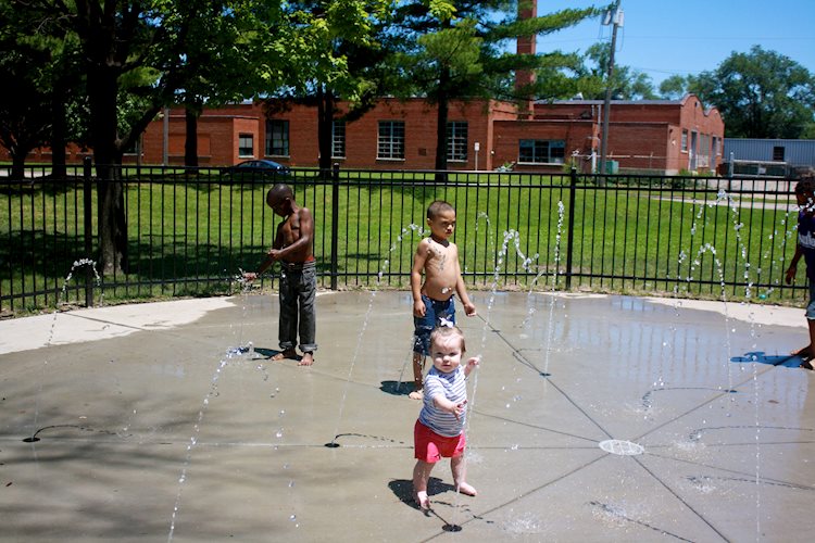 Kids playing in the splashpad at comer cox park