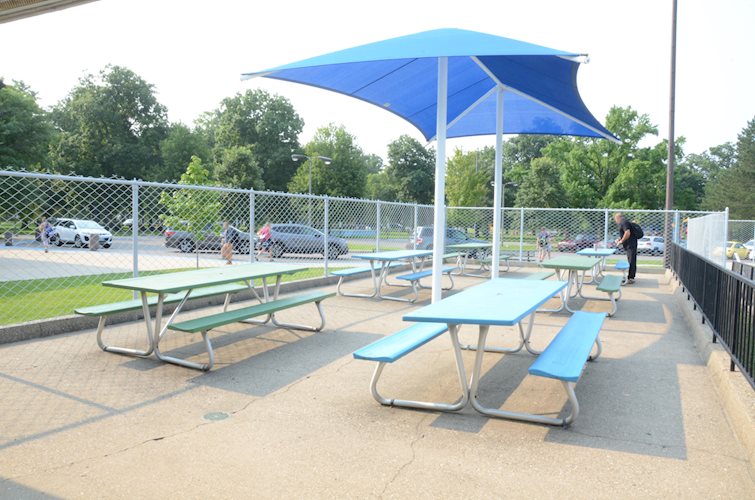 Nelson Center Outdoor Pool outdoor picnic tables, for birthday party rentals or first come first serve use.